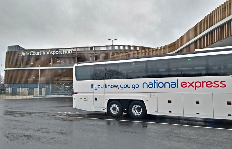 A National Express coach in front of Arle Court Transport Hub building